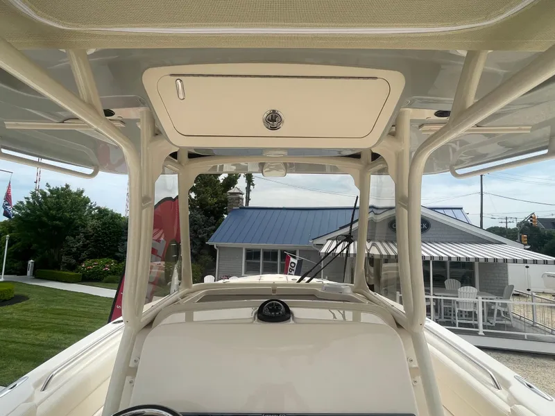 Slide: The Image of 2025 Grady-White Canyon 271 center console boat with T-top and helm station. - 16