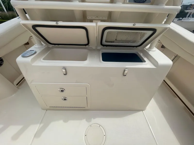 Slide: The Image of 2025 Grady-White Canyon 271 boat storage compartments and drawers. - 20