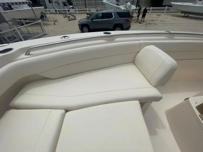 Slide: The Image of 2025 Grady-White Canyon 271 boat with luxurious white seating. - 5