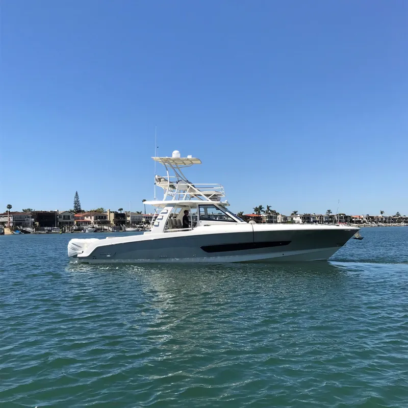 Slide: The Image of 2018 Boston Whaler 420 Outrage boat cruising on a sunny day. - 0