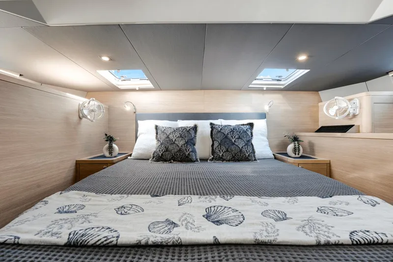Slide: The Image of Luxurious bedroom interior of 2024 Aquila 44 Yacht with skylights and elegant decor. - 0