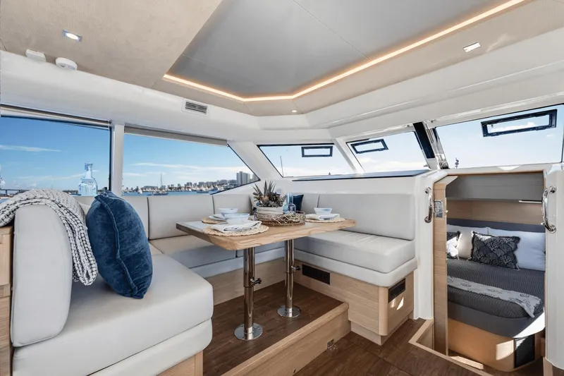 Slide: The Image of Luxurious interior of 2024 Aquila 44 Yacht with dining area and cozy cabin. - 11