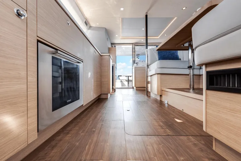 Slide: The Image of Interior of 2024 Aquila 44 Yacht with modern wood finishes and spacious layout. - 12