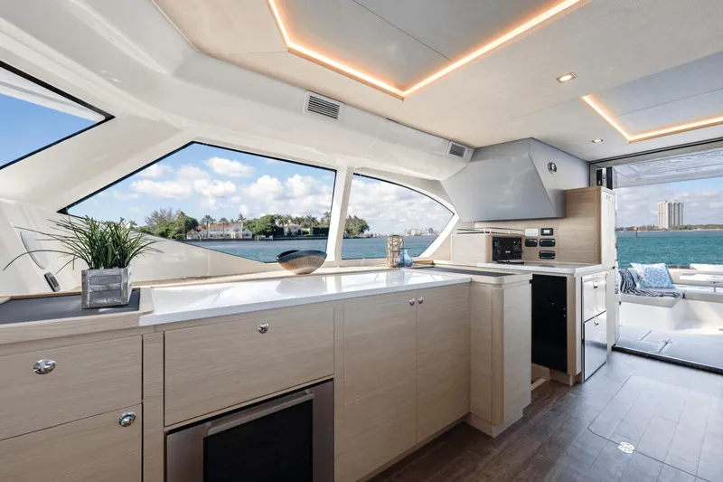 Slide: The Image of Interior of 2024 Aquila 44 Yacht with modern kitchen and ocean view. - 13
