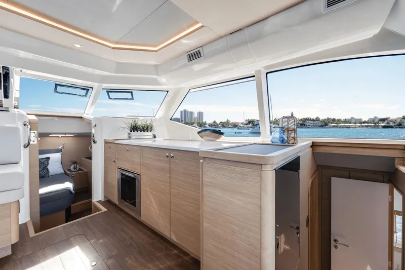 Slide: The Image of Interior of 2024 Aquila 44 Yacht with modern kitchen and scenic windows. - 16