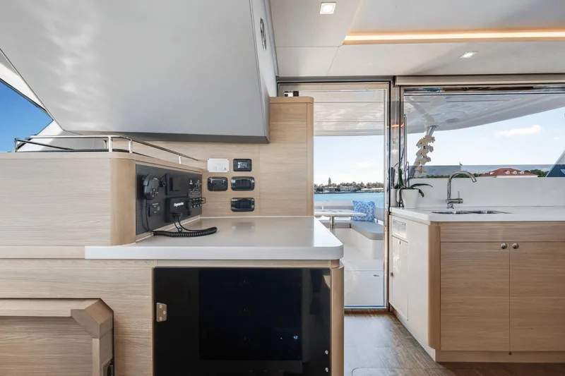 Slide: The Image of Interior of 2024 Aquila 44 Yacht with modern kitchen and navigation controls. - 17