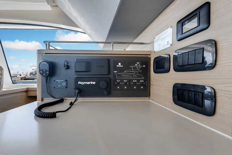 Slide: The Image of Control panel of 2024 Aquila 44 Yacht with Raymarine and Fusion systems. - 18