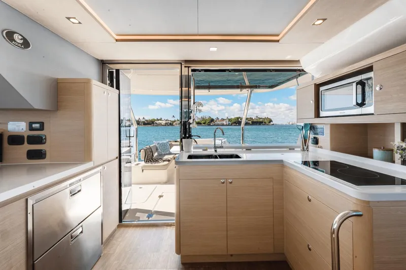 Slide: The Image of Modern kitchen interior on 2024 Aquila 44 Yacht with ocean view. - 19