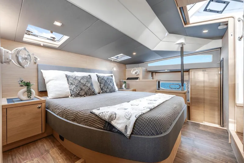 Slide: The Image of Luxurious bedroom interior of 2024 Aquila 44 Yacht with skylights and modern decor. - 2