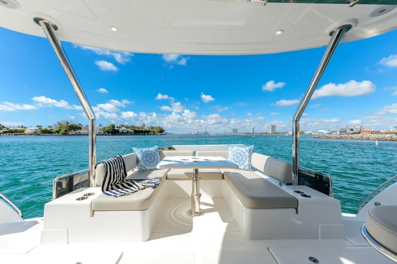 Slide: The Image of Aquila 44 Yacht 2024 model with luxurious seating and ocean view. - 20