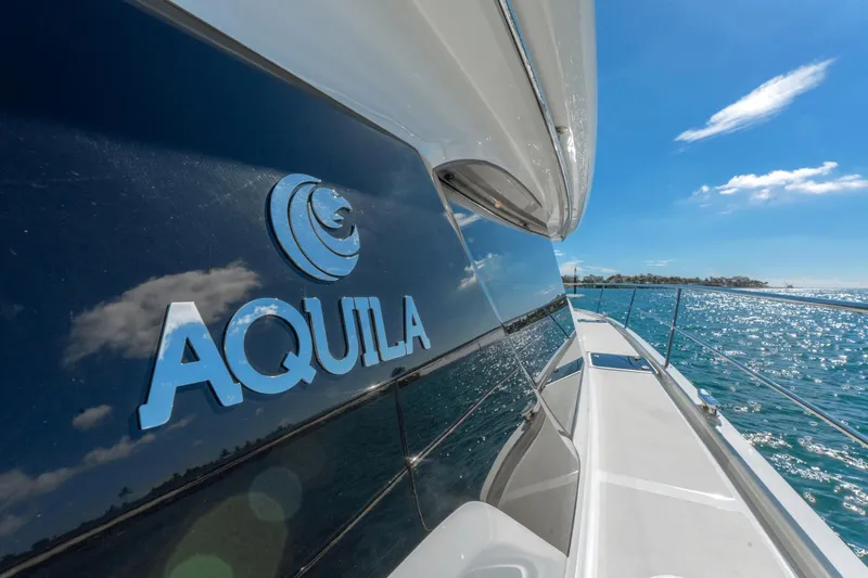 Slide: The Image of 2024 Aquila 44 Yacht on a sunny day, reflecting the ocean and sky. - 25