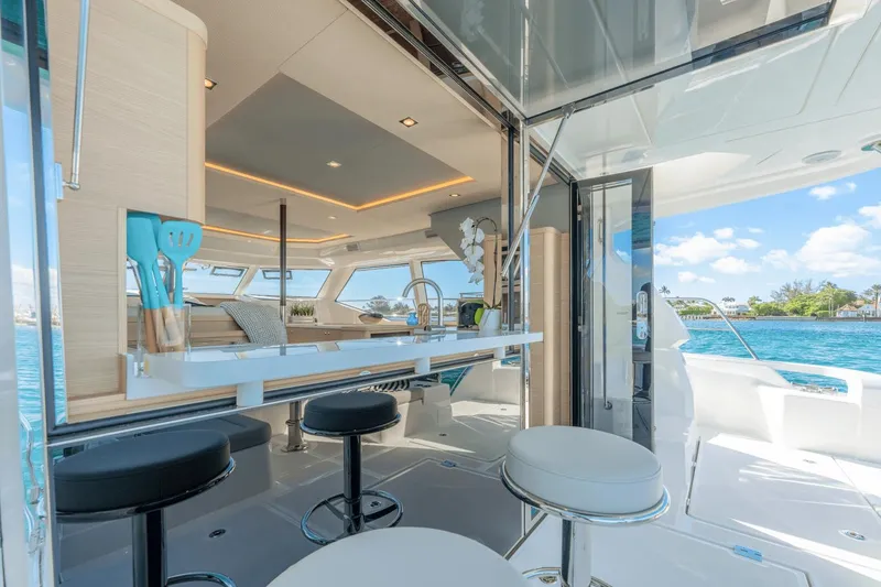 Slide: The Image of Interior of 2024 Aquila 44 Yacht with modern seating and ocean view. - 27
