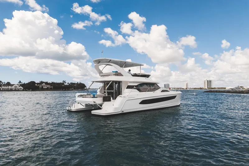 Slide: The Image of 2024 Aquila 44 Yacht cruising on a sunny day. - 38