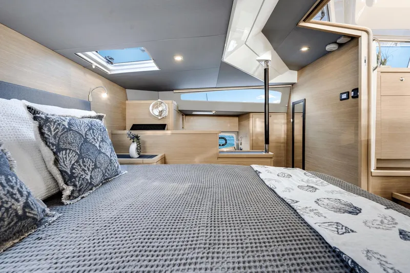 Slide: The Image of Luxurious bedroom interior of 2024 Aquila 44 Yacht with modern decor and skylight. - 4