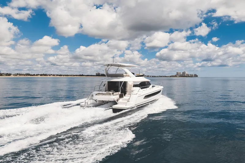 Slide: The Image of 2024 Aquila 44 Yacht cruising on a calm, sunny day. - 47