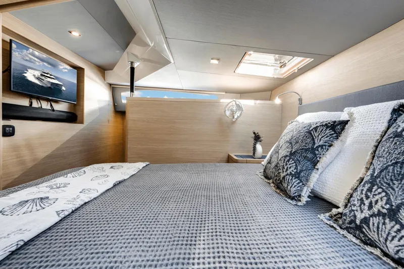 Slide: The Image of Luxurious bedroom interior of 2024 Aquila 44 Yacht with modern decor and TV. - 5