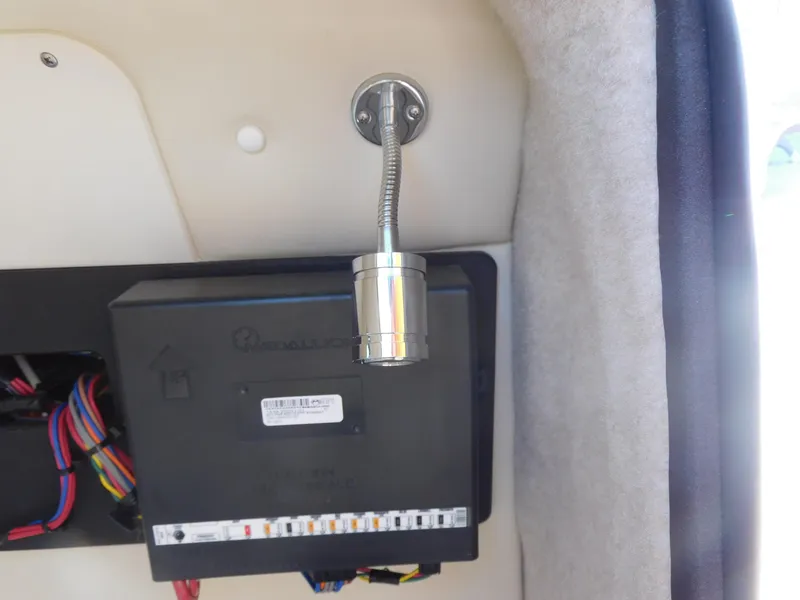 Slide: The Image of 2024 Stingray 212 SC boat interior wiring and light fixture. - 19