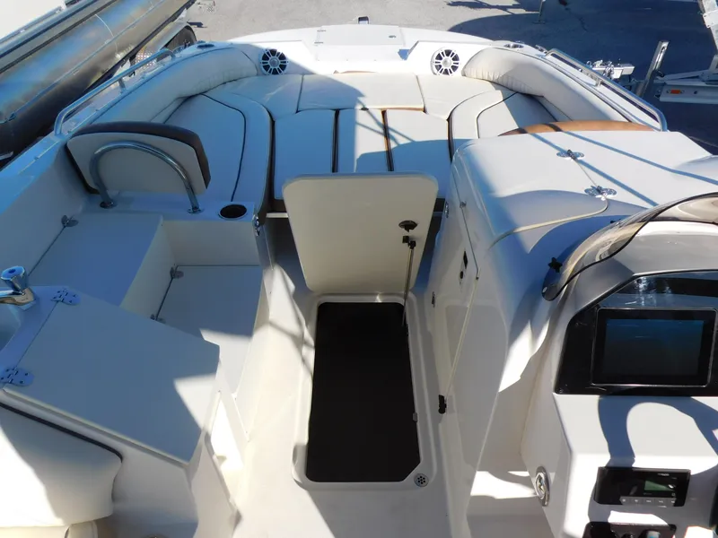Slide: The Image of 2024 Stingray 212 SC boat interior with seating and storage compartments. - 20