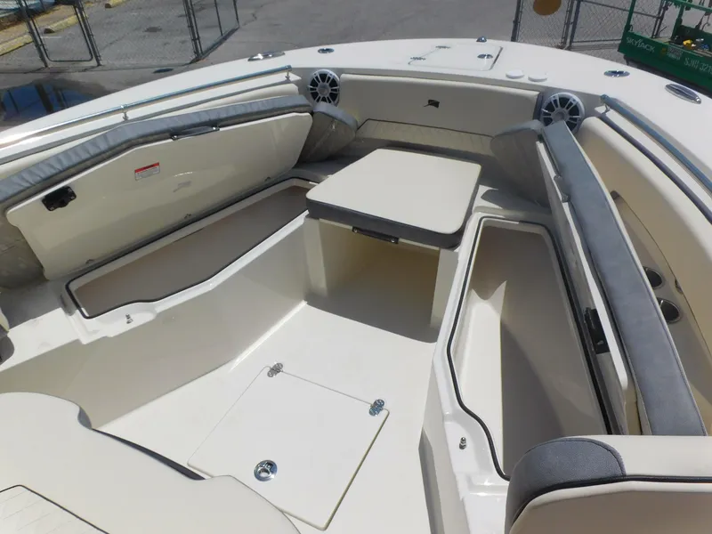 Slide: The Image of 2024 Stingray 253 CC boat interior with seating and storage compartments. - 13