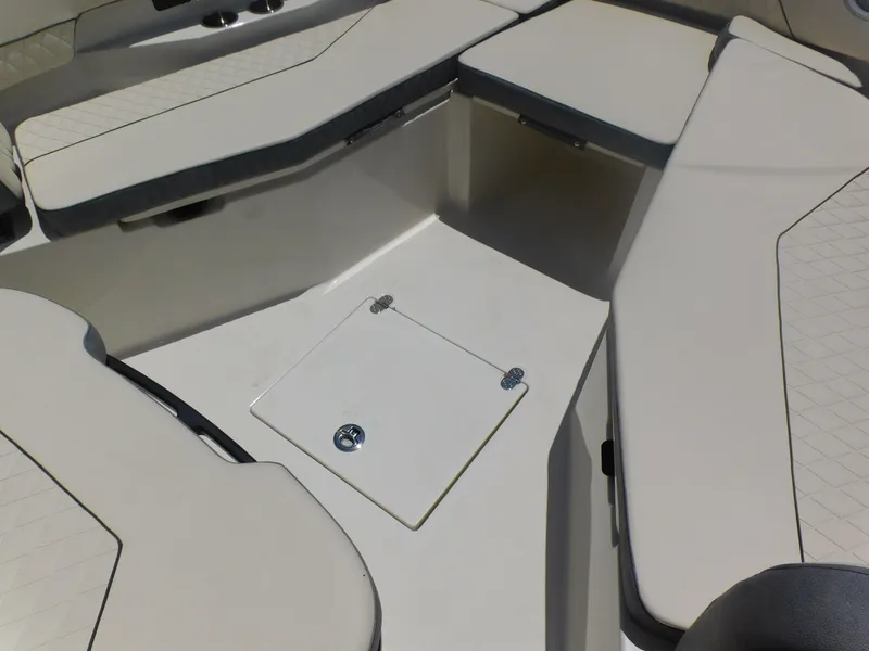 Slide: The Image of 2024 Stingray 253 CC boat interior seating and storage compartment. - 16