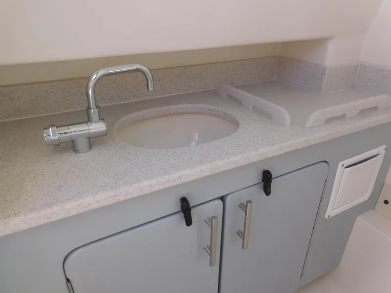 Slide: The Image of 2024 Stingray 253 CC boat interior sink and countertop - 32