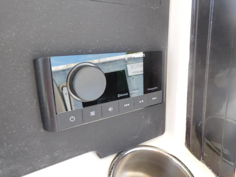 Slide: The Image of 2024 Stingray 253 CC boat dashboard with Bluetooth audio system. - 34