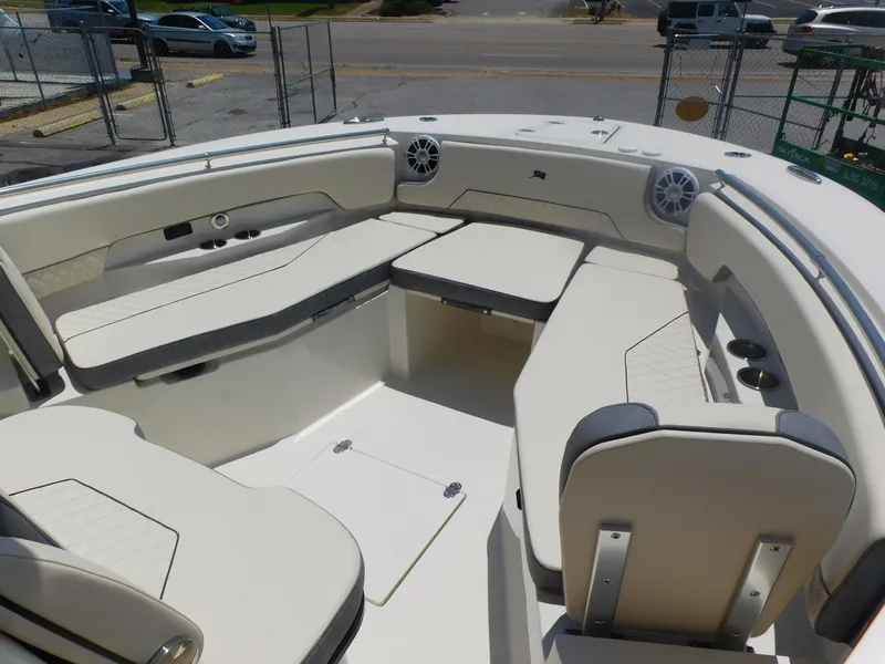 Slide: The Image of 2024 Stingray 253 CC boat interior with spacious seating and modern design. - 8