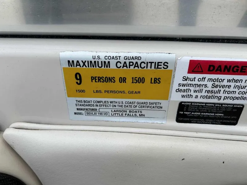 Slide: The Image of 2002 Larson SEi 190 boat capacity label, 9 persons or 1500 lbs, U.S. Coast Guard compliant. - 4