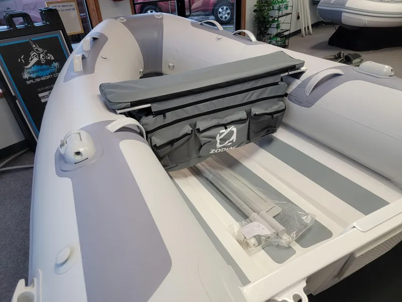 Slide: The Image of 2024 Zodiac Cadet RIB Alu 270 inflatable boat interior with storage bag. - 1