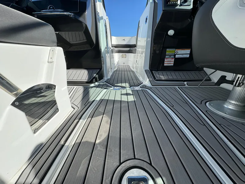 Slide: The Image of 2018 Monterey 258 Super Sport boat interior with sleek, modern flooring and seating. - 11