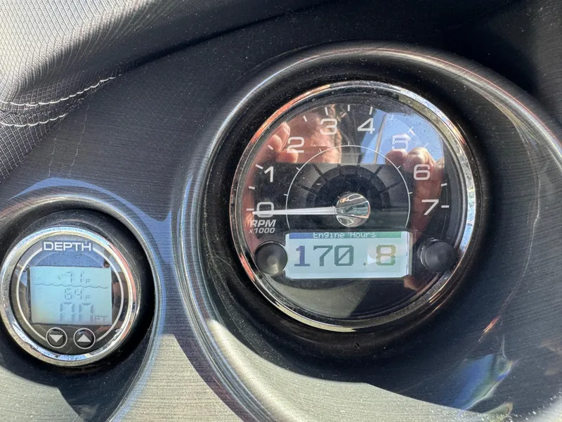 Slide: The Image of Close-up of 2018 Monterey 258 Super Sport boat gauges showing RPM and depth. - 15