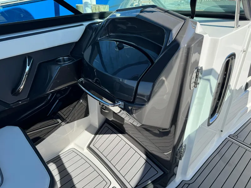 Slide: The Image of 2018 Monterey 258 Super Sport boat interior with sleek black and white design. - 17