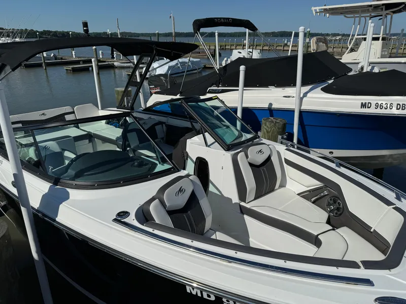 Slide: The Image of 2018 Monterey 258 Super Sport boat docked at a marina. - 2