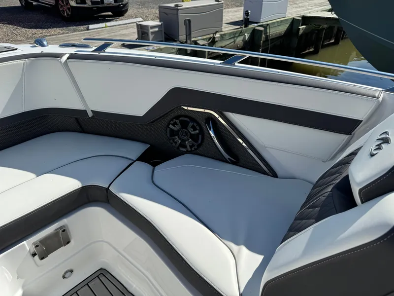 Slide: The Image of 2018 Monterey 258 Super Sport boat interior with white and black seating. - 21