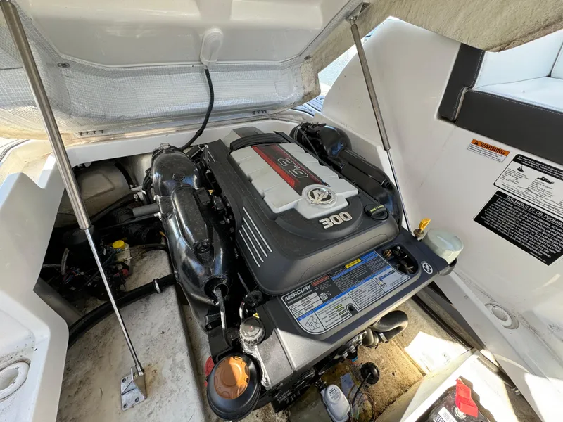 Slide: The Image of 2018 Monterey 258 Super Sport boat engine compartment with 300 horsepower engine. - 24