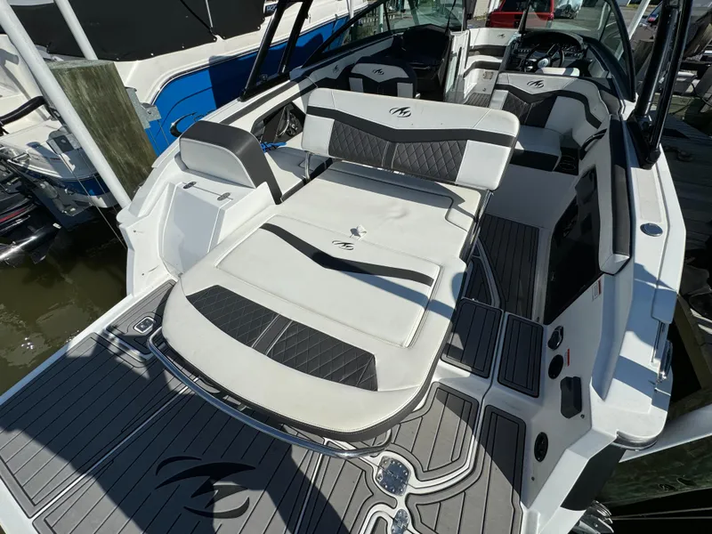 Slide: The Image of 2018 Monterey 258 Super Sport boat interior with white and black seating. - 26