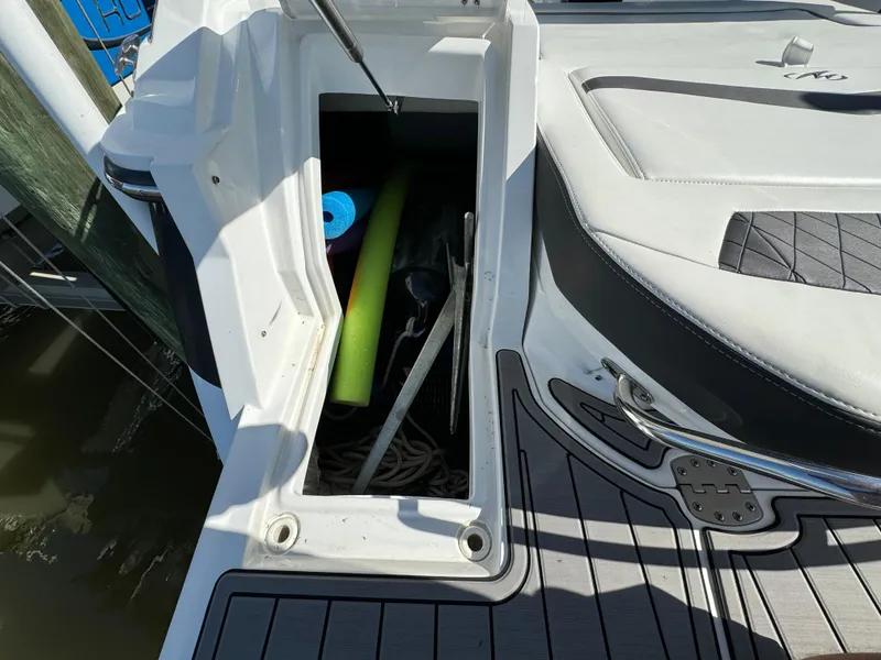 Slide: The Image of Open storage compartment on a 2018 Monterey 258 Super Sport boat. - 27