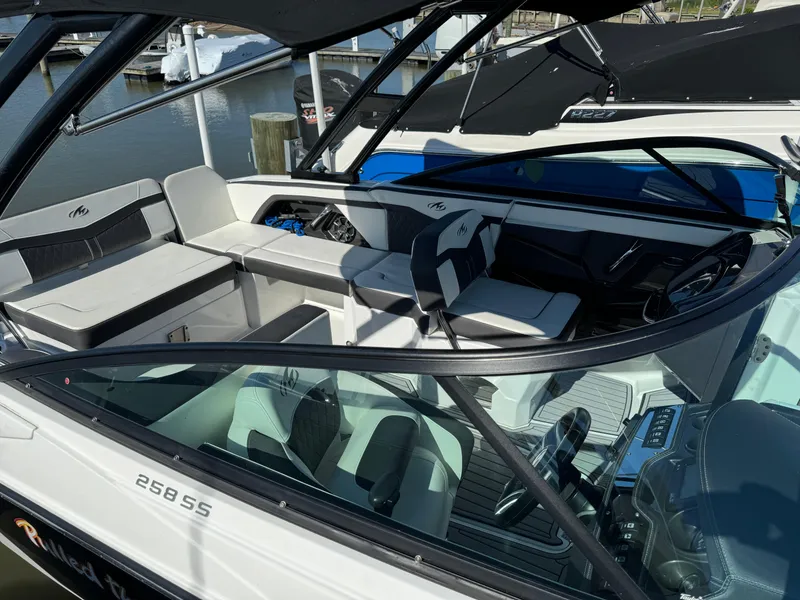 Slide: The Image of 2018 Monterey 258 Super Sport boat interior with seating and steering wheel. - 3