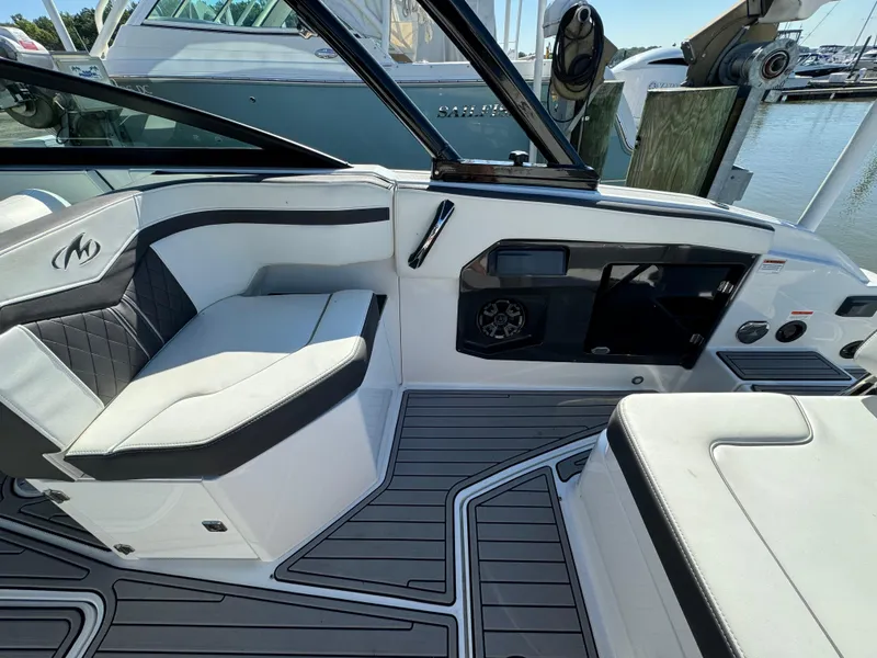 Slide: The Image of 2018 Monterey 258 Super Sport boat interior with seating and control panel. - 8