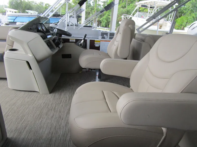 Slide: The Image of Interior of 2024 Sweetwater Split Bench SW 2286 SB pontoon boat with beige seating. - 6