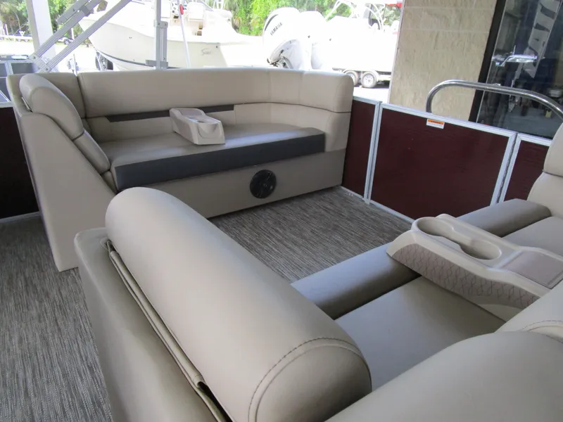 Slide: The Image of 2024 Sweetwater Split Bench SW 2286 SB interior with beige seating and cup holders. - 7