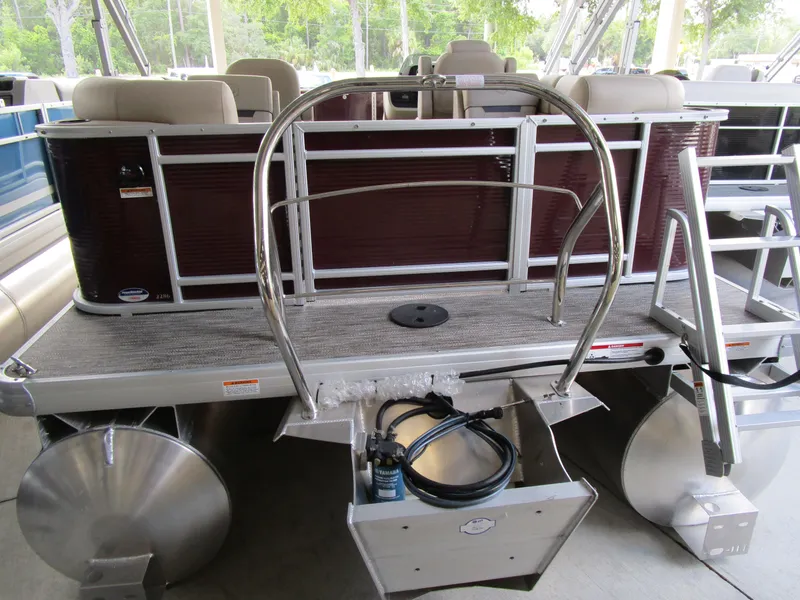 Slide: The Image of 2024 Sweetwater Split Bench SW 2286 SB pontoon boat rear view with ladder and seating. - 8
