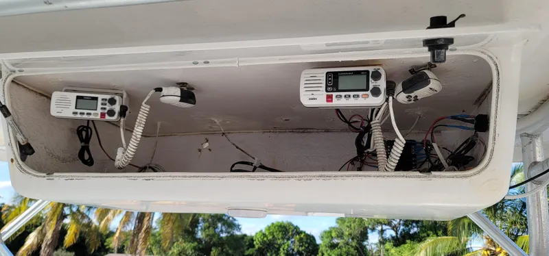 Slide: The Image of 2000 Pro-Line 29 Walkaround boat electronics compartment with communication devices and wiring. - 10