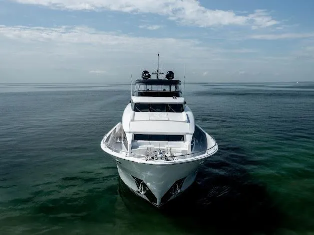Slide: The Image of 2015 Hatteras 100 Raised Pilothouse yacht on calm ocean waters. - 12
