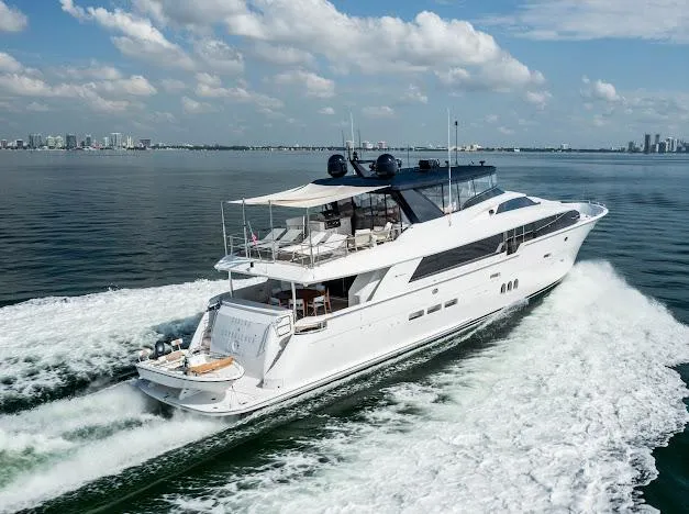 Slide: The Image of 2015 Hatteras 100 Raised Pilothouse yacht cruising on open water. - 15