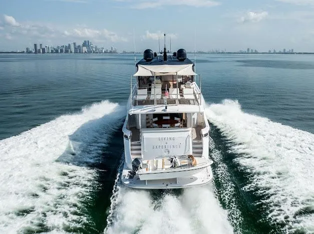 Slide: The Image of 2015 Hatteras 100 Raised Pilothouse yacht cruising near city skyline. - 16