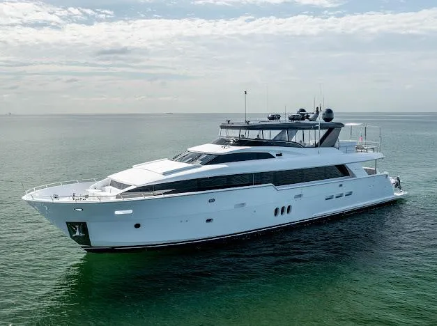 Slide: The Image of 2015 Hatteras 100 Raised Pilothouse luxury yacht on calm sea. - 2