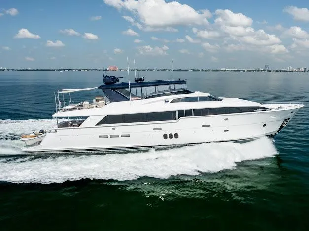 Slide: The Image of 2015 Hatteras 100 Raised Pilothouse yacht cruising on open water. - 3