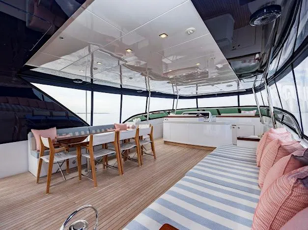 Slide: The Image of Luxurious interior of 2015 Hatteras 100 Raised Pilothouse yacht with dining area and lounge. - 31