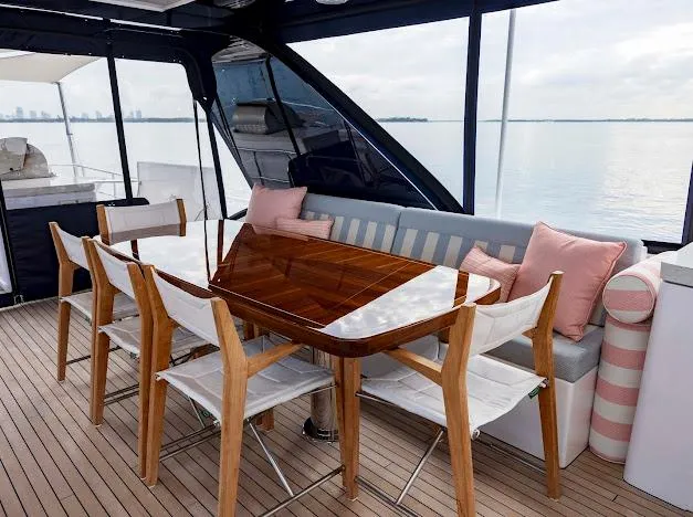 Slide: The Image of Luxury dining area on 2015 Hatteras 100 Raised Pilothouse yacht with ocean view. - 34